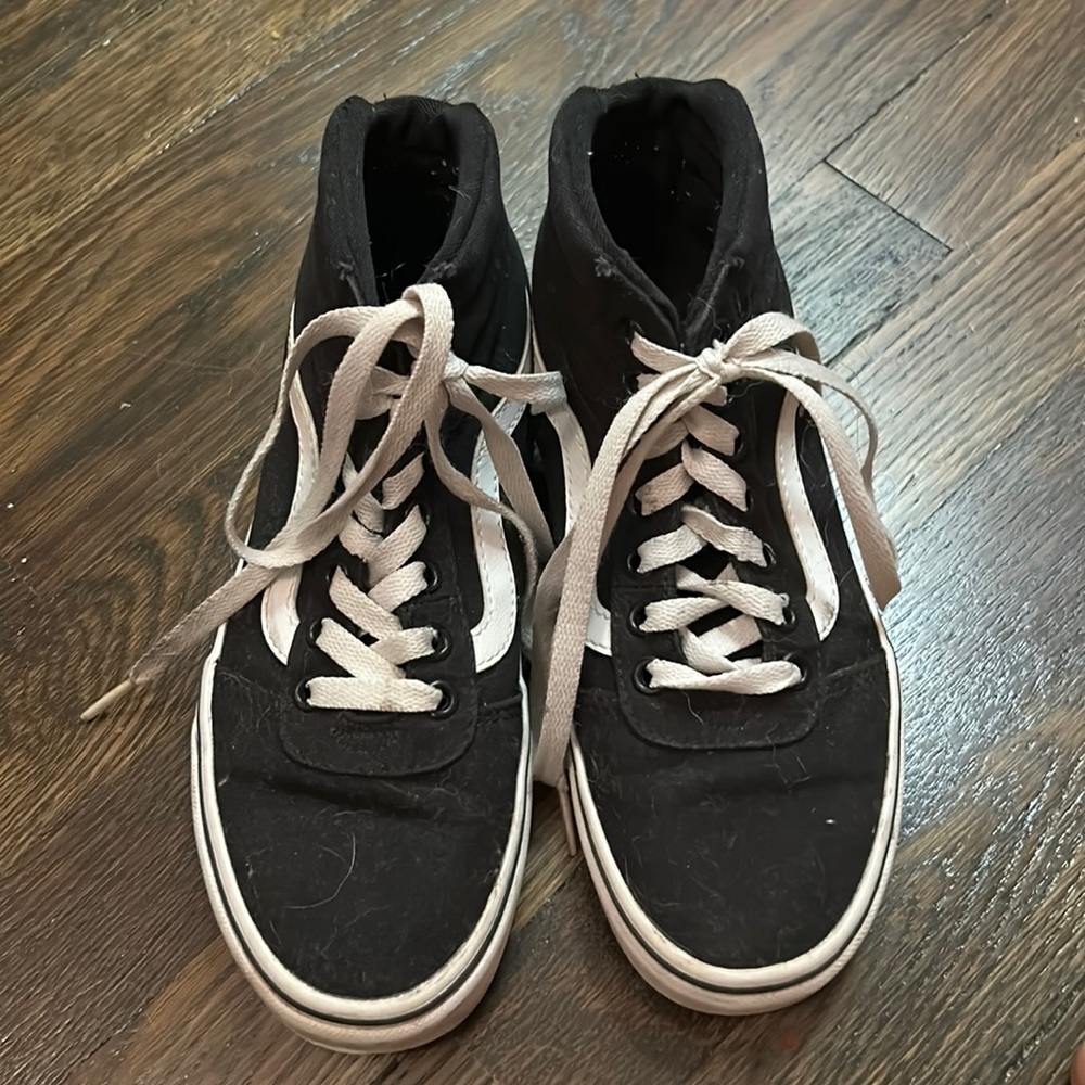 Black and white high top vans barely worn practically perfect condition.